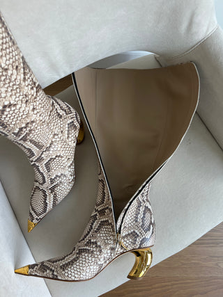 Gold tipped python leather boots