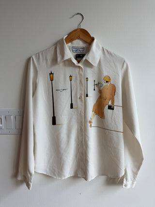 Woman in taupe lantern silk blouse