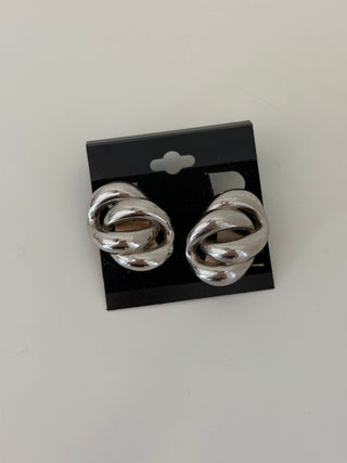 Silvertone intertwined love knot clip-ons