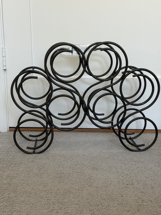 Raw iron spiral wine rack